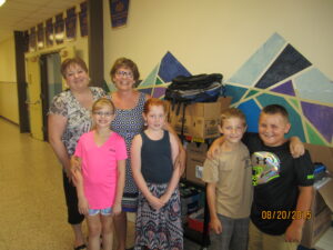 Pinpoint CEO Brenda Raker drops off school supplies to students at local elementary school during Pack the Sack event.
